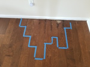 Warped hardwood flooring — moisture damage Jacksonville FL