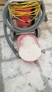 Advanced Flooring Removal team executing dust-free flooring removal protocols using containment barriers.