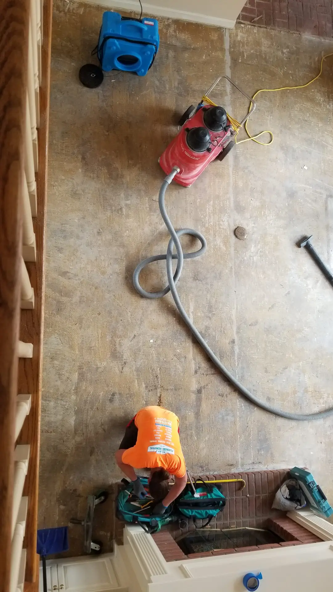 After wood floor removal — AFR crew member with clean slab Mandarin Jacksonville