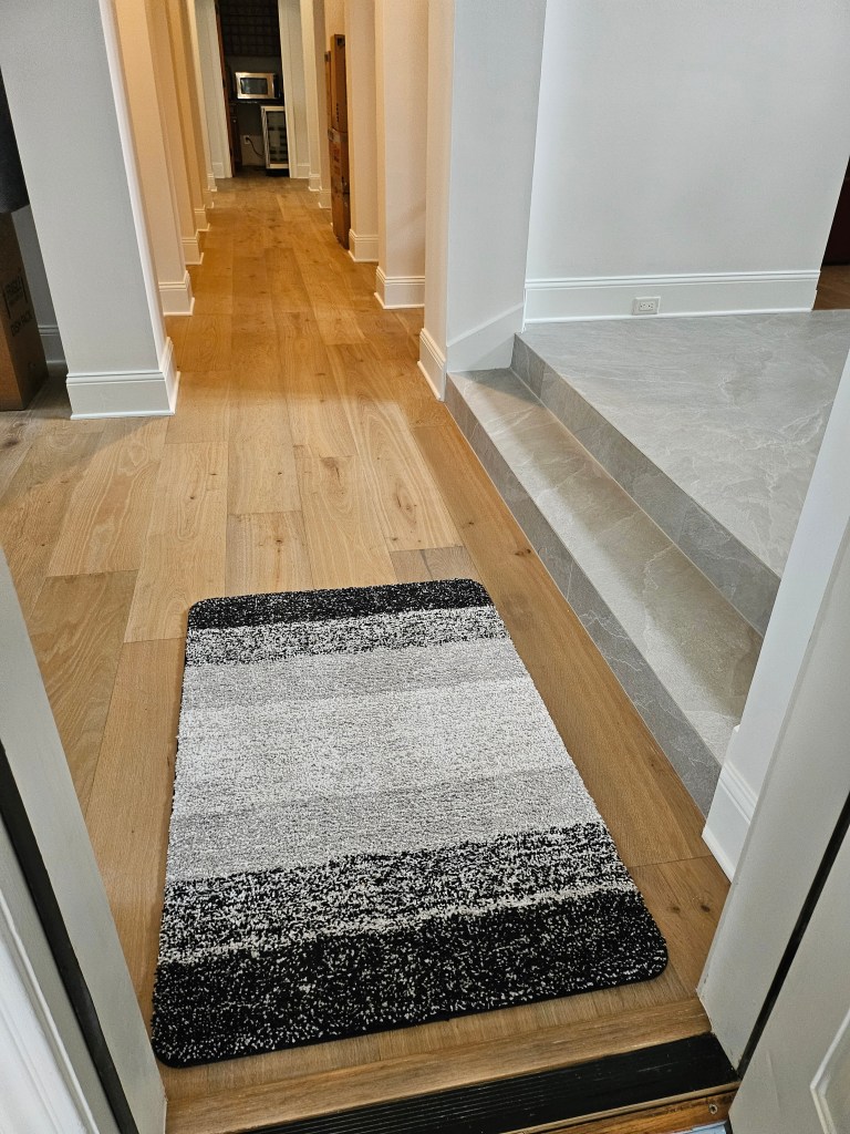 Engineered white oak flooring installed in a hallway by Advanced Flooring Removal